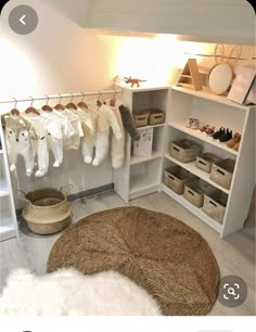 the closet is filled with baby clothes and other things to put in it's storage area