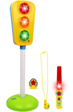 a toy traffic light and other toys on a white background with the words kiddie play above it