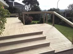 a wooden deck with steps leading up to it