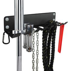 a metal pole with chains hanging from it's sides and two red handles on each end