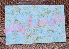 a close up of a piece of paper on a wicker basket with the words happy mother's day written in pink