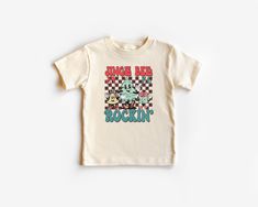 Looking for a fun and festive way to get your little one in the holiday spirit? Look no further than this adorable kids Christmas t-shirt! Featuring a playful design with bright colors and cheerful graphics, this shirt is sure to be a hit with kids of all ages. Made from soft and comfortable materials, it's perfect for wearing to holiday parties, family gatherings, or just around the house. So why wait? Order your child's Christmas t-shirt today and let the holiday fun begin! .: 100% Airlume combed and ringspun cotton (fiber content may vary for different colors) .: Extra light fabric (3.9 oz/yd² (132 g/m .: Tear-away label Ink Printing, Boho Kids, Merry Christmas Shirts, Toddler Christmas, Retro Halloween, Toddler Tees, Retro Shirts, Kid Tees, Retro Christmas