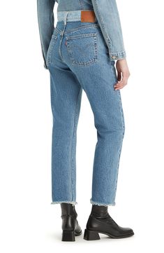 A restitched waistband and raw hems bring DIY vibes to these classic jeans made from nonstretch denim in a straight-leg silhouette. 25" inseam; 14" leg opening; 11" front rise; 15 1/2" back rise (size 29X26) Button fly Five-pocket style 100% cotton Machine wash, tumble dry Imported Levi's Straight Leg Jeans With Frayed Hem, Split Hair, Levi's 501, Classic Jeans, Levis 501, Straight Leg Jeans, Leg Jeans, Levi's, Straight Leg