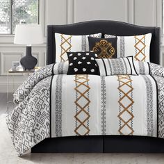 black and white bedding with gold accents