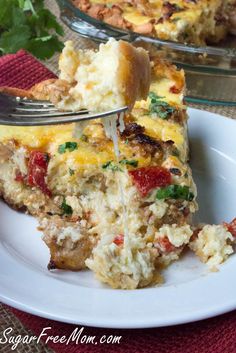 a slice of quiche on a plate with a fork