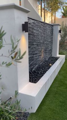 an outdoor fountain with water flowing from it