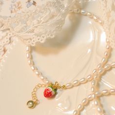 Indulge in the delight of our Strawberry Pearl Bracelet, a harmonious fusion of eternal pearls and charming playfulness. Each radiant pearl is carefully selected and strung together, enhanced by an intricately enameled strawberry charm. Crafted from 18K gold on brass, this whimsical piece exudes luxury and elegance. Embrace the delightful fusion of classic beauty and modern charm, and let this exquisite piece adorn you with its enchanting allure. Details Plating: 18K Gold Materials: 18K Gold on Strawberry Beads, Strawberry Charm, Beach Bracelets, Cool Art Drawings, Jewelry Inspo, Pearl Size, Classic Beauty, Beaded Chain, Gold Material