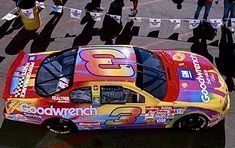 a colorful car is parked on the street