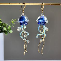 Our cute colorful jellyfish earrings are made with transparent glass shell, high quality Japanese glass beads and 14K gold plated hooks are comfortable for delicate ears. since each jellyfish is handmade, each one will have a unique look. Size: approx. 1" wide and 3.75" long 🌺 The jellyfishes are made with glass, please handle with care. Jelly Fish Inspired Garments, Jellyfish Earrings Diy, Bead Jellyfish, Aquatic Jewelry, Jellyfish Transparent, Beaded Jellyfish, Deep Sea Jellyfish, Beach Wedding Theme, Sea Jellyfish