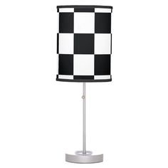 a black and white checkered lamp on a metal base