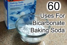 a box of baking soda sitting on top of a counter next to a glass bowl