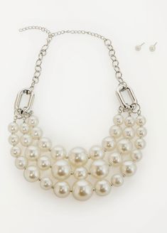 Layered faux pearls add dainty charm to the edginess of this silver-tone chain link necklace matched with delicate stud earrings. Pearl Bib Necklace, Vintage Assemblage Necklace, Assemblage Necklace, Vintage Assemblage, Pearl Necklace Set, Faux Pearl Necklace, Ashley Stewart, Necklace Fashion, Bib Necklace