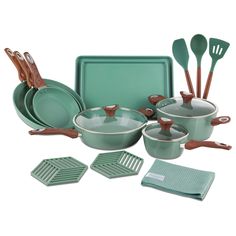 green pots and pans with wooden utensils