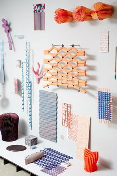 a white table topped with lots of different colored objects