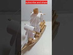 a paper model of a boat with sails