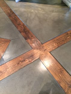 the floor is made out of concrete and has been painted with wood trimmings