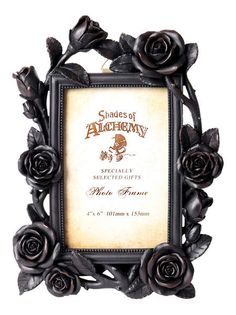 an ornate black frame with roses on it