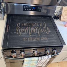 a sign that says happiness is homemade on an oven