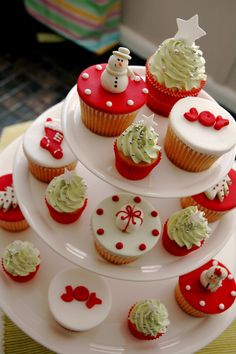 cupcakes are arranged on top of each other in the shape of a christmas tree