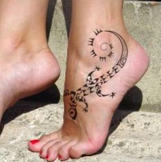 a woman's foot with a tattoo on it