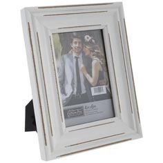 a white wooden frame with an image of a man and woman