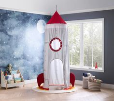 a child's room with a rocket ship bed