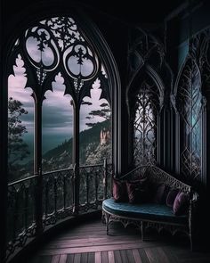 a room with an arched window overlooking the mountains