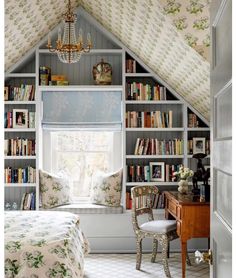 a bedroom with a bed, desk and bookshelf in it's corner