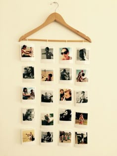 a wooden hanger with pictures hanging on it's side next to a wall