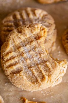 an image of some cookies with powdered sugar on them and one cookie has been cut in half