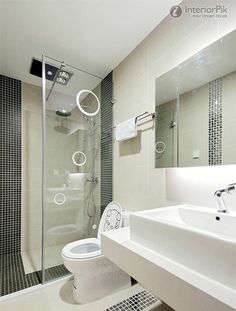 a bathroom with a toilet, sink and shower stall