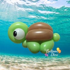 an inflatable turtle swimming under the water