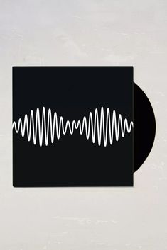 a black and white sticker with an image of a sound wave on it's side