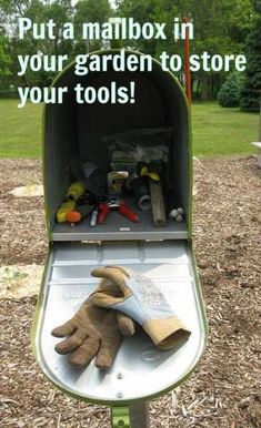 an open mailbox with gardening tools in it and the words put a mailbox in your garden to store your tools