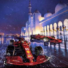 two red race cars in front of a white building at night with snow falling on the ground