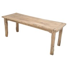 a wooden bench sitting on top of a white floor