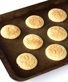 nine cookies are on a baking tray ready to be baked