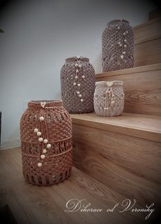 three crocheted baskets sitting on the steps