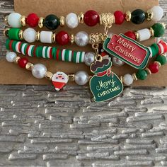 Set Of 4 Merry Christmas Beaded Holiday Charm Bracelets New Merry Christmas Charms, Santa Claus, Seed Beads, Pearls Gold Beaded Christmas Bracelets, Gold Beaded Bracelets For Christmas, Christmas Party Beaded Bracelets, Holiday Jewelry With Letter Beads, Beaded Jewelry For Christmas Holiday, Holiday Jewelry With Letter Round Beads, Holiday Jewelry With Round Letter Beads, Multicolor Beaded Bracelets For Christmas, Christmas Gift Beaded Bracelets With Round Beads