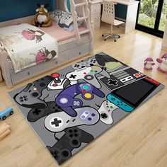 a rug with video game controllers on it in a child's playroom area