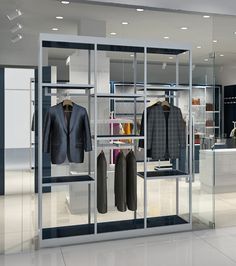 a clothing store with clothes and jackets on display