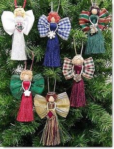 an ornament is hanging on a christmas tree with other ornaments in the shape of angels