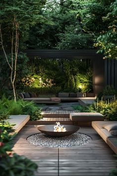 an outdoor fire pit surrounded by plants and trees