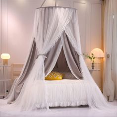 a bed with a white canopy over it