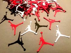 many red and black air jordans are on the table