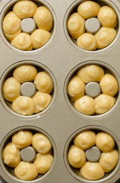 the doughnuts are ready to be baked in the muffin tin