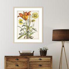 a painting hanging on the wall next to a dresser with flowers and plants in it