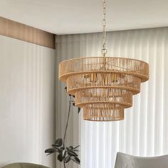 a chandelier hanging from the ceiling in a living room