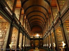 the inside of a large library filled with lots of books