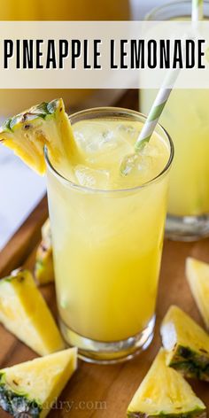 pineapple lemonade in a glass on a cutting board